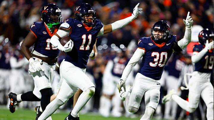 Maddox Marcellus, Ethan Minter and the Cavaliers defense celebrate a crucial turnover against Virginia Tech. Maddox Marcellus, Ethan Minter and the Cavaliers defense celebrate a crucial turnover against Virginia Tech.