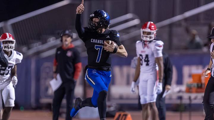 Chandler quarterback Will Mencl celebrates on the way to the end zone during the Wolves' first-round Open Division playoff game against Brophy. | Photo: Corey Cross Chandler quarterback Will Mencl celebrates on the way to the end zone during the Wolves' first-round Open Division playoff game against Brophy. | Photo: Corey Cross
