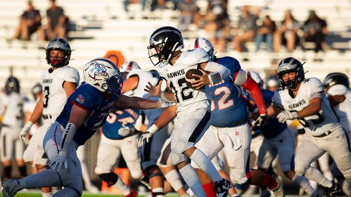 LCHS defensive players tackle a Volcano Vista player Friday, August 18, 2023, at the Field of Dreams. | Meg Potter/Sun-News / USA TODAY NETWORK LCHS defensive players tackle a Volcano Vista player Friday, August 18, 2023, at the Field of Dreams. | Meg Potter/Sun-News / USA TODAY NETWORK