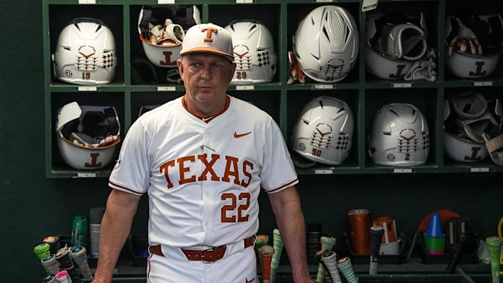 Texas Longhorns head coach Jim Schlossnagle stands in the dugout ahead of the Lone Star Showdown