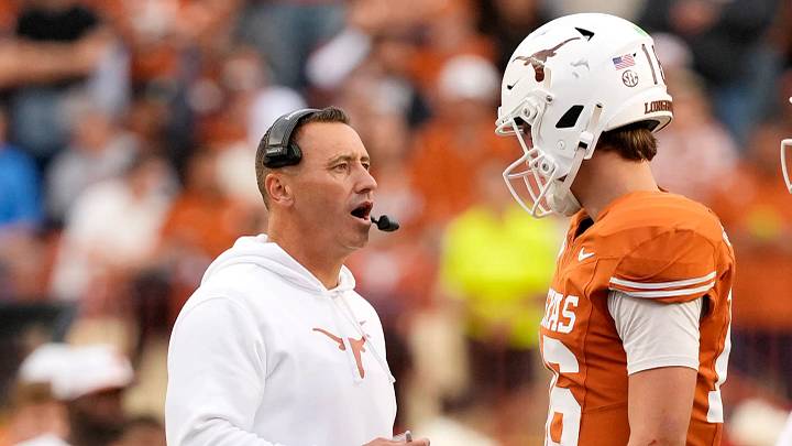 Texas Longhorns head coach Steve Sarkisian talks with quarterback Arch Manning (16) during a timeout in the second half against the Vanderbilt Commodores at Darrell K Royal-Texas Memorial Stadium.