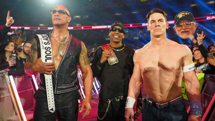 The Rock, Travis Scott, and John Cena at Elimination Chamber on March 1, 2025. The Rock, Travis Scott, and John Cena at Elimination Chamber on March 1, 2025.