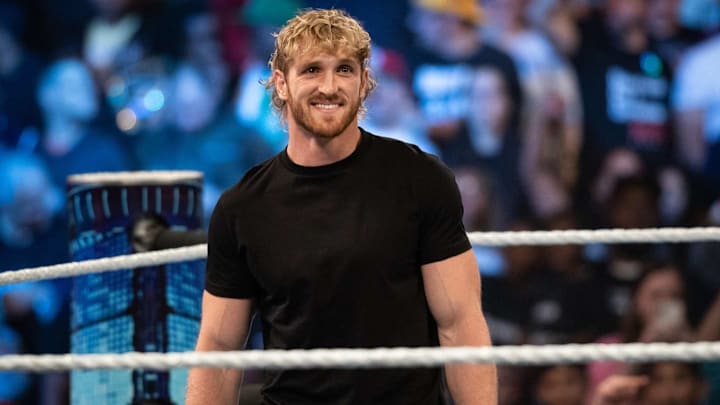 Logan Paul enters the ring at a WWE event. 