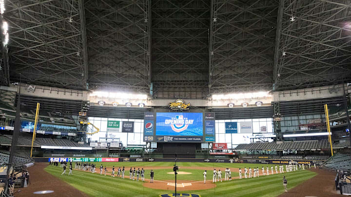 The Milwaukee Brewers and Chicago White Sox stand for the National Anthem opening day ceremonies on
