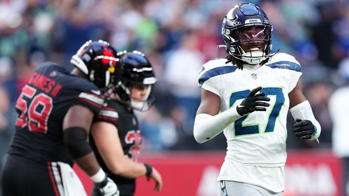 Dec 8, 2024; Glendale, Arizona, USA; Seattle Seahawks cornerback Riq Woolen (27) celebrates after a missed field goal by Arizona Cardinals place kicker Chad Ryland (38) during the second half at State Farm Stadium. 