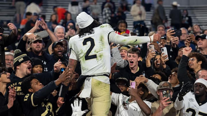 Robby Ashford (2) celebrating with fans following Wake Forest's 16–9 upset over Virginia, Nov. 8, 2025.
