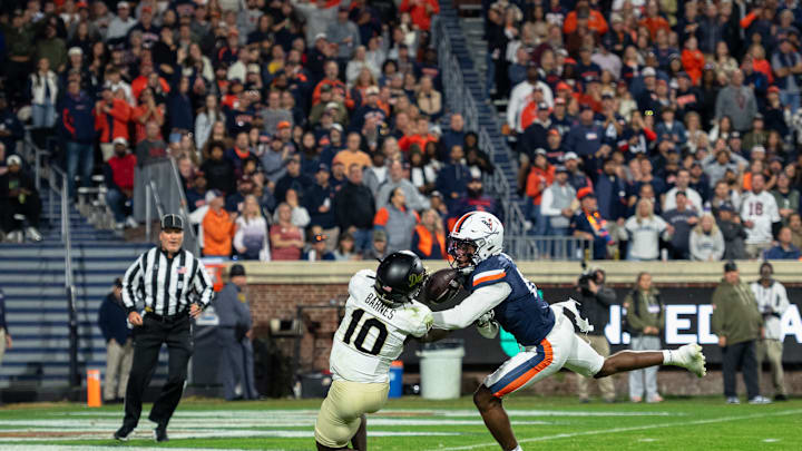 Chris Barnes goes up to make catch against defensive back 