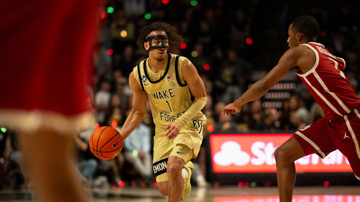 Wake Forest point guard Nate Calmese dribbles the ball against Oklahoma 