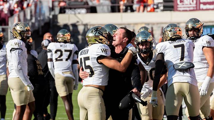 Head coach Jake Dickert and safety Nick Andersen (45) embrace after defeating the Virginia Tech Hokies, Oct. 4, 2025. Head coach Jake Dickert and safety Nick Andersen (45) embrace after defeating the Virginia Tech Hokies, Oct. 4, 2025.
