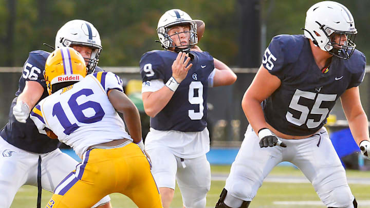 McDowell High School offensive lineman Cooper Cousins blocks for quarterback