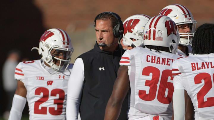 Oct 21, 2023; Champaign, Illinois, USA;  Wisconsin Badgers head coach Luke Fickell with his players during the first half against the Illinois Fighting Illini at Memorial Stadium. 