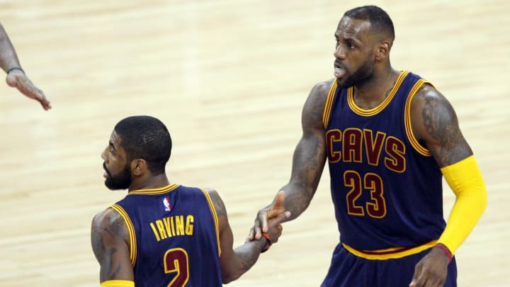 Apr 24, 2016; Auburn Hills, MI, USA; Cleveland Cavaliers guard Kyrie Irving (2) high fives forward LeBron James (23) during the fourth quarter against the Detroit Pistons in game four of the first round of the NBA Playoffs at The Palace of Auburn Hills. Cavs win 100-98. Mandatory Credit: Raj Mehta-USA TODAY Sports