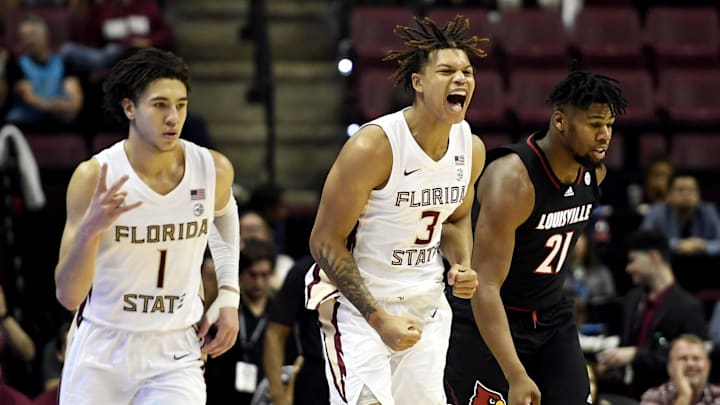 Dec 10, 2022; Tallahassee, Florida, USA; Florida State Seminoles forward Cameron Corhen (3) and guard Jalen Warley (1) react to a made basket during the game against the Louisville Cardinals at Donald L. Tucker Center. Mandatory Credit: Melina Myers-USA TODAY Sports