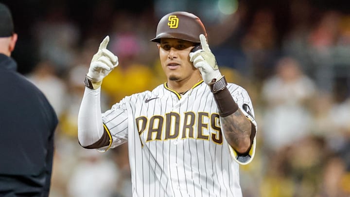 Mar 27, 2026; San Diego, California, USA; San Diego Padres third baseman Manny Machado (13) celebrates after hitting a double during the fourth inning against the Detroit Tigers at Petco Park. Mandatory Credit: David Frerker-Imagn Images