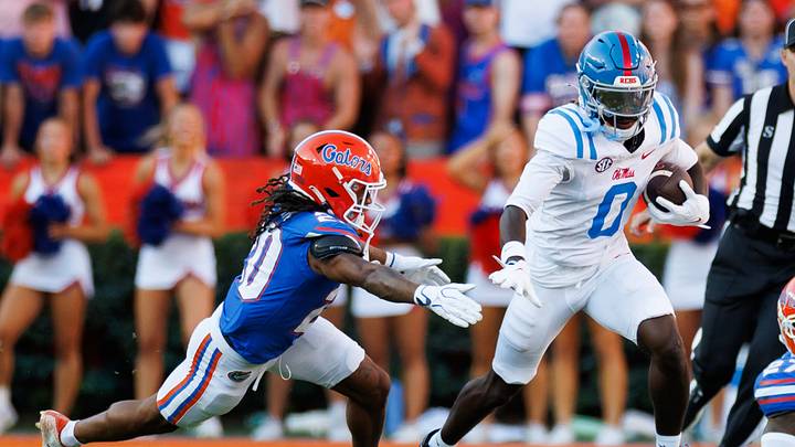 Sep 26, 2026; Gainesville, Florida, USA; Mississippi Rebels wide receiver Johntay Cook II (0) runs from Florida Gators defender Kanye Clark (20) during the first half at Ben Hill Griffin Stadium. Mandatory Credit: Matt Pendleton-Imagn Images Sep 26, 2026; Gainesville, Florida, USA; Mississippi Rebels wide receiver Johntay Cook II (0) runs from Florida Gators defender Kanye Clark (20) during the first half at Ben Hill Griffin Stadium. Mandatory Credit: Matt Pendleton-Imagn Images