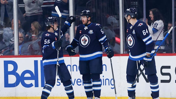 Dylan Samberg (54) is congratulated by teammates after scoring against the Chicago Blackhawks during the first period at Canada Life Centre. Dylan Samberg (54) is congratulated by teammates after scoring against the Chicago Blackhawks during the first period at Canada Life Centre.