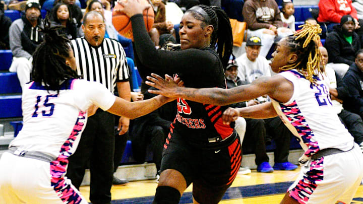 Savannah Wilson (middle) and the No. 1 Parkway Panthers are attempting to win their third consecutive state title.