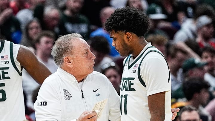 Michigan State head coach Tom Izzo talks to guard Jase Richardson (11) at a timeout against Bryant during the second half of the First Round of NCAA Tournament at Rocket Arena in Cleveland, Ohio on Friday, March 21, 2025.