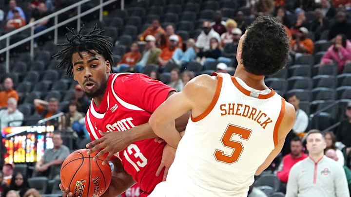 Nov 4, 2024; Las Vegas, Nevada, USA; Ohio State Buckeyes forward Sean Stewart (13) fouls Texas Longhorns forward Kadin Shedrick (5) during the second half at T-Mobile Arena. Mandatory Credit: Stephen R. Sylvanie-Imagn Images