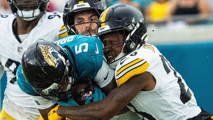 Pittsburgh Steelers cornerback Brandin Echols (26) tackles Jacksonville Jaguars wide receiver Dyami Brown (5) during the first half of the first preseason game where the Jacksonville Jaguars hosted the Pittsburgh Steelers Saturday Aug. 9, 2025, at EverBank Stadium in Jacksonville, Fla. [Doug Engle/Florida Times-Union]