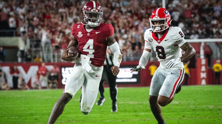 Sep 28, 2024; Tuscaloosa, Alabama, USA; Georgia Bulldogs defensive back Joenel Aguero (8) pursues Alabama Crimson Tide quarterback Jalen Milroe (4) as he runs for the end zone during the first quarter at Bryant-Denny Stadium. Mandatory Credit: Will McLelland-Imagn Images