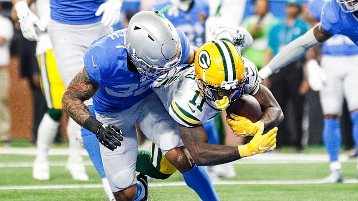 Green Bay Packers receiver Jayden Reed catches a touchdown against Detroit Lions safety Brian Branch last season.