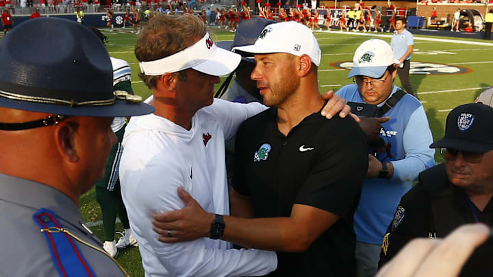 Sep 20, 2025; Oxford, Mississippi, USA; Mississippi Rebels head coach Lane Kiffin (left) and Tulane Green Wave head coach Jon Sumrall (right) embrace after the game at Vaught-Hemingway Stadium. Mandatory Credit: Petre Thomas-Imagn Images