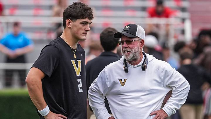 Oct 3, 2026; Athens, Georgia, USA; Vanderbilt Commodores quarterback Jared Curtis (2) talks to offensive consultant Jerry Kill on the field before the game against the Georgia Bulldogs at Sanford Stadium. Mandatory Credit: Dale Zanine-Imagn Images