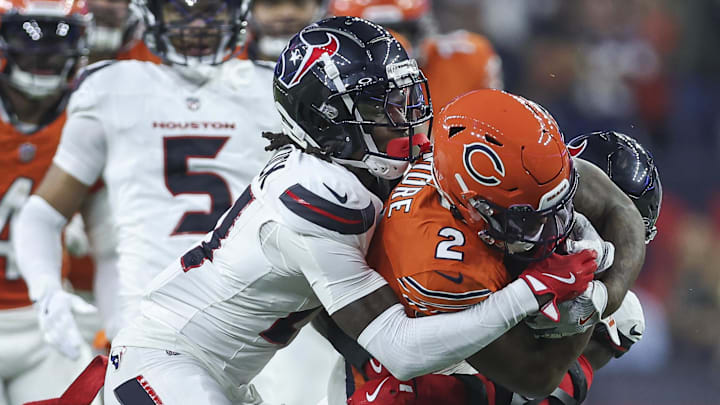 Sep 15, 2024; Houston, Texas, USA; Houston Texans safety Calen Bullock (21) attempts to tackle Chicago Bears wide receiver DJ Moore (2) during the game at NRG Stadium. Mandatory Credit: Troy Taormina-Imagn Images Sep 15, 2024; Houston, Texas, USA; Houston Texans safety Calen Bullock (21) attempts to tackle Chicago Bears wide receiver DJ Moore (2) during the game at NRG Stadium. Mandatory Credit: Troy Taormina-Imagn Images
