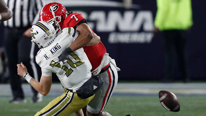 Georgia linebacker Marvin Jones Jr. (7) gets to Georgia Tech quarterback Haynes King (10) for a red