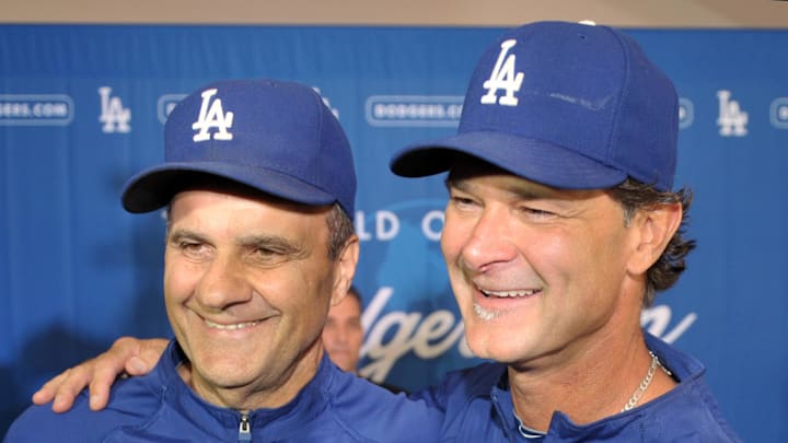 Los Angeles Dodgers manager Joe Torre (left) and hitting coach Don Mattingly at a press conference to announce Don Mattingly as the Dodgers manager at Dodger Stadium on Sept. 17, 2010.
