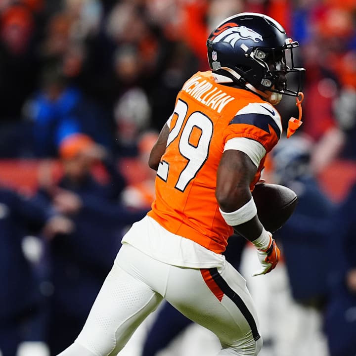 Denver Broncos CB Ja'quan McMillian celebrates after intercepting a pass intended for Buffalo Bills WR Brandin Cooks.