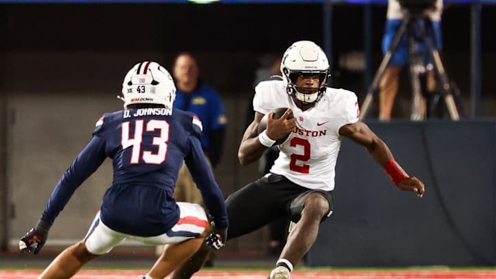 Nov 15, 2024; Tucson, Arizona, USA; Houston Cougars quarterback Zeon Chriss (2) runs with the ball during the third quarter against the Arizona Wildcats at Arizona Stadium. Mandatory Credit: Aryanna Frank-Imagn Images