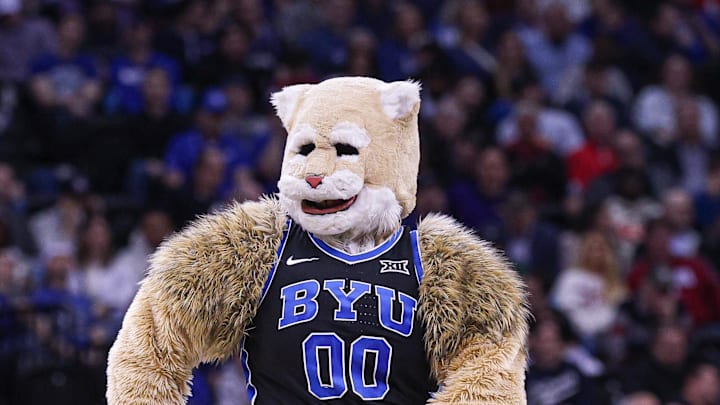 Mar 27, 2025; Newark, NJ, USA; Brigham Young Cougars mascot Cosmo the Cougar performs during an East Regional semifinal of the 2025 NCAA tournament against the Alabama Crimson Tide at Prudential Center. Mandatory Credit: Vincent Carchietta-Imagn Images