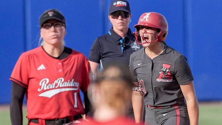Alabama outfielder Ana Roman (21) celebrates getting on second base in the second inning during a softball game at the Women’s College World Series between Texas Tech and Alabama at Devon Park in Oklahoma City, on Monday, June 1, 2026. Alabama outfielder Ana Roman (21) celebrates getting on second base in the second inning during a softball game at the Women’s College World Series between Texas Tech and Alabama at Devon Park in Oklahoma City, on Monday, June 1, 2026.