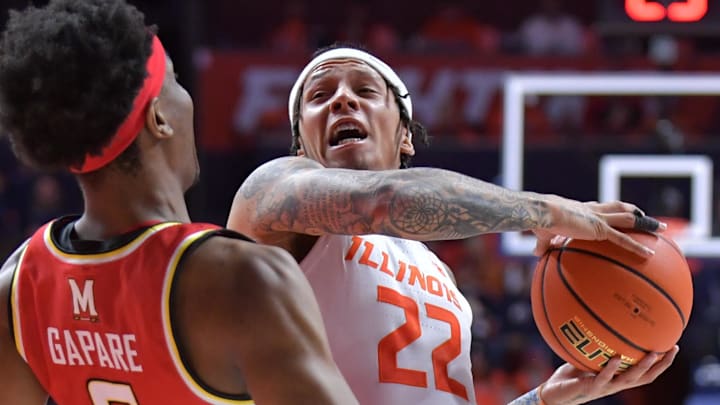 Jan 23, 2025; Champaign, Illinois, USA; Maryland Terrapins forward Tafara Gapare (6) tries to draw a foul on Illinois Fighting Illini guard Tre White (22) as he drives to the basket during the first half at State Farm Center. Mandatory Credit: Ron Johnson-Imagn Images Jan 23, 2025; Champaign, Illinois, USA; Maryland Terrapins forward Tafara Gapare (6) tries to draw a foul on Illinois Fighting Illini guard Tre White (22) as he drives to the basket during the first half at State Farm Center. Mandatory Credit: Ron Johnson-Imagn Images