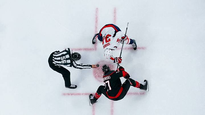 Oct 13, 2026; Raleigh, North Carolina, USA; Carolina Hurricanes left wing Mark Jankowski (77) and Washington Capitals center Justin Sourdif (34) take a face off during the second period at Lenovo Center. Mandatory Credit: James Guillory-Imagn Images Oct 13, 2026; Raleigh, North Carolina, USA; Carolina Hurricanes left wing Mark Jankowski (77) and Washington Capitals center Justin Sourdif (34) take a face off during the second period at Lenovo Center. Mandatory Credit: James Guillory-Imagn Images