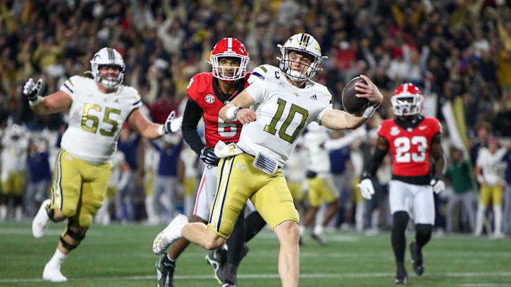 Nov 25, 2023; Atlanta, Georgia, USA; Georgia Tech Yellow Jackets quarterback Haynes King (10) runs for a touchdown against the Georgia Bulldogs in the first quarter at Bobby Dodd Stadium at Hyundai Field. Mandatory Credit: Brett Davis-Imagn Images