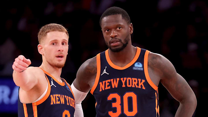 Nov 1, 2023; New York, New York, USA; New York Knicks guard Donte DiVincenzo (0) talks to forward Julius Randle (30) during the fourth quarter against the Cleveland Cavaliers at Madison Square Garden. Mandatory Credit: Brad Penner-Imagn Images