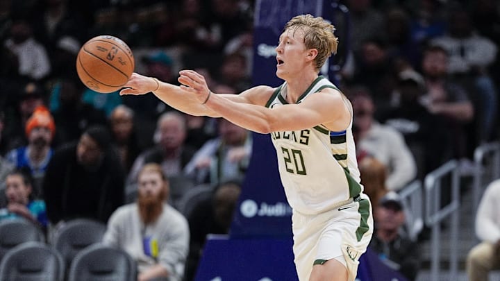 Nov 12, 2025; Charlotte, North Carolina, USA;  Milwaukee Bucks guard AJ Green (20) passes the ball against the Charlotte Hornets during the second half at Spectrum Center. Mandatory Credit: Jim Dedmon-Imagn Images