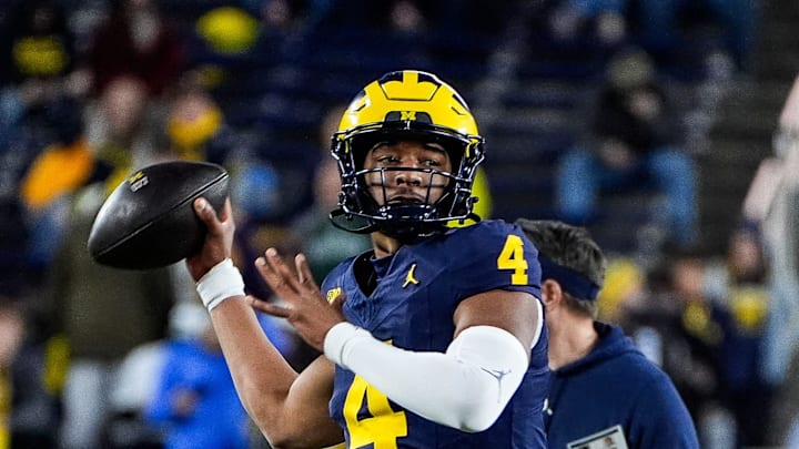 Michigan quarterback Jayden Denegal (4) warms up before the Michigan State game at Michigan Stadium in Ann Arbor on Saturday, Oct. 26, 2024.