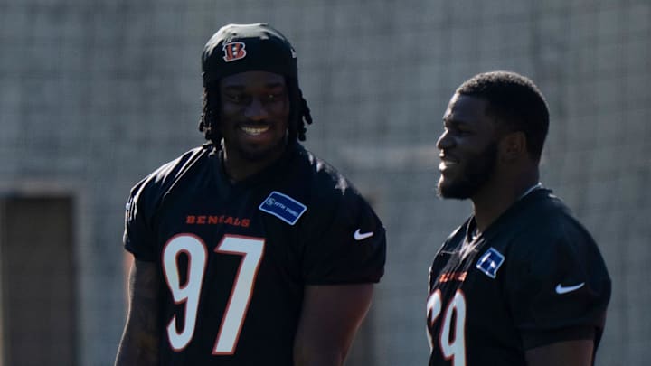 Bengals defensive end Shemar Stewart, left, smiles with Bengals defensive tackle Dante Barnett during the Bengals Rookie Mini Camp on Friday, May 9, 2025 at Paycor Stadium in Cincinnati.