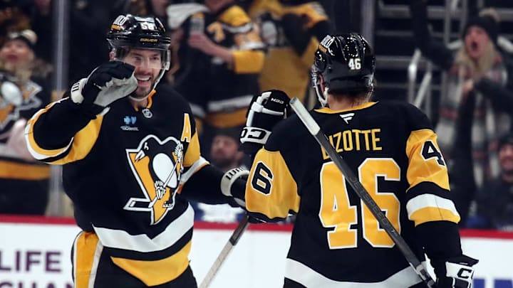 Dec 7, 2024; Pittsburgh, Pennsylvania, USA; Pittsburgh Penguins defenseman Kris Letang (58) congratulates center Blake Lizotte (46) after Lizotte scored an empty net goal against the Toronto Maple Leafs during the third period at PPG Paints Arena. Dec 7, 2024; Pittsburgh, Pennsylvania, USA; Pittsburgh Penguins defenseman Kris Letang (58) congratulates center Blake Lizotte (46) after Lizotte scored an empty net goal against the Toronto Maple Leafs during the third period at PPG Paints Arena.