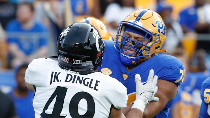 Sep 9, 2023; Pittsburgh, Pennsylvania, USA;  Pittsburgh Panthers offensive lineman Branson Taylor (78) blocks against Cincinnati Bearcats linebacker Jack Dingle (49) during the first quarter at Acrisure Stadium. Mandatory Credit: Charles LeClaire-Imagn Images