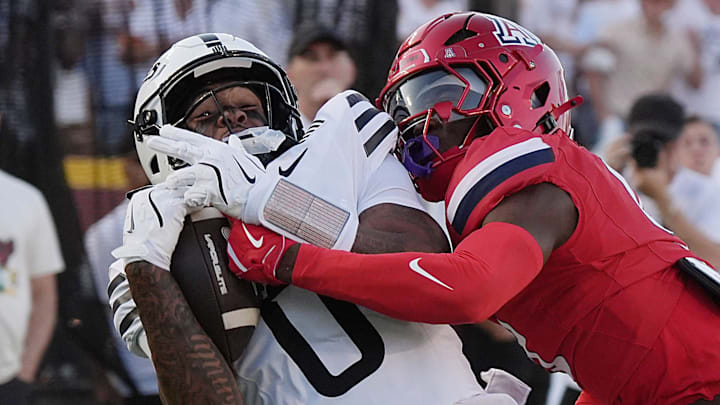 Iowa State Cyclones' wide receiver Chase Sowell (0) catches a around Arizona Wildcats defensive back Ayden Garnes (9) during the first quarter in the Big-12 conference showdown on Sept. 27, 2025, at Jack Trice Stadium in Ames, Iowa.