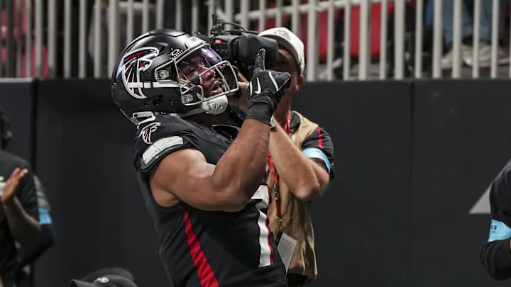 Jan 5, 2025; Atlanta, Georgia, USA; Atlanta Falcons running back Bijan Robinson (7) reacts after running for a touchdown against the Carolina Panthers during the second half at Mercedes-Benz Stadium. Mandatory Credit: Dale Zanine-Imagn Images