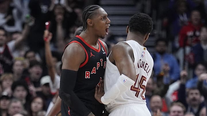 Apr 23, 2026; Toronto, Ontario, CAN; Toronto Raptors forward RJ Barrett (9) celebrates as Cleveland Cavaliers guard Donovan Mitchell (45) tries to walk away during the second half of game three of the first round of the 2026 NBA Playoffs at Scotiabank Arena. Mandatory Credit: John E. Sokolowski-Imagn Images