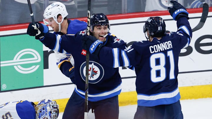 Apr 19, 2025; Winnipeg, Manitoba, CAN; Winnipeg Jets forward Alex Iafallo (9) celebrates his goal against St. Louis Blues goalie Jordan Binnington (50) during the third period in game one of the first round of the 2025 Stanley Cup Playoffs at Canada Life Centre. Mandatory Credit: Terrence Lee-Imagn Images