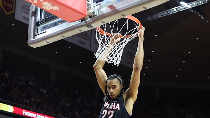 Dec 15, 2024; Ames, Iowa, USA; Nebraska-Omaha Mavericks forward Kamryn Thomas (22) scores on a dunk in their game with the Iowa State Cyclones during the second half at James H. Hilton Coliseum. Mandatory Credit: Reese Strickland-Imagn Images