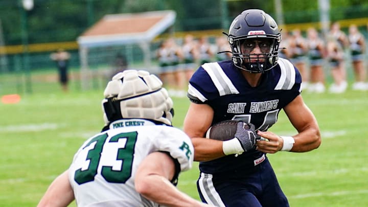 St. Edward's' Keegan Nyman (right) gains yardage against Pine Crest during a high school football game on Thursday, September 5, 2024. On Friday, Nyman shined on the defensive side of the ball, recording 11 tackles in a win over Tradition Prep.